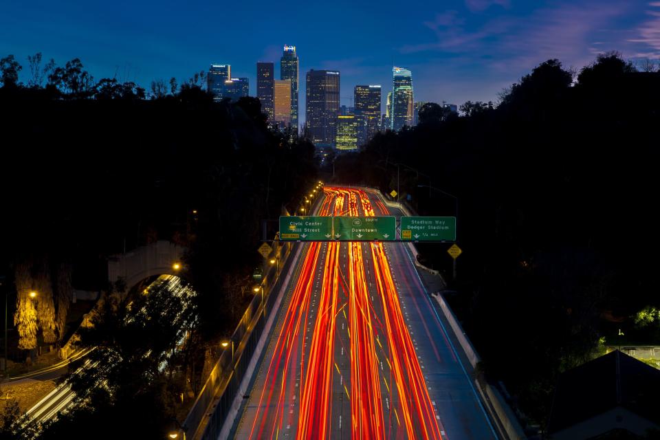 Pasadena Freeway, Arroyo Seco Parkway, CA 110 leads to downtown Los Angeles with streaked car lights at sunset. (Photo by: Visions of America/Education Images/Universal Images Group via Getty Images)