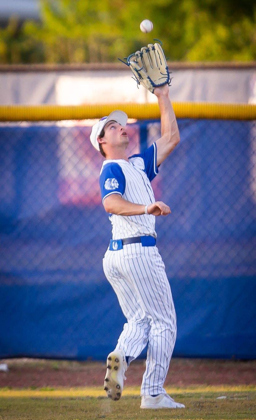 Keystone Heights outfielder Connor Guy catches a fly ball against Clay.