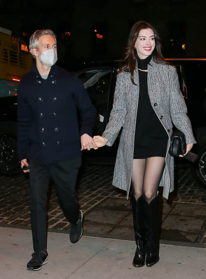 Anne Hathaway and Adam Shulman are spotted holding hands as they head to Soho House in NYC on Dec 2. - Credit: Splash