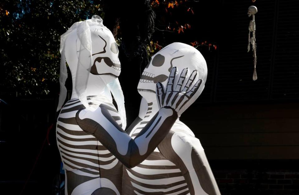 Nathaniel Bell and his fiancé Sarah Kelley are in trouble with Columbia code enforcement about their halloween decorations. The citation to remove the decorations or be fined or face jail time declares the embracing skeletons, that they purchased on Amazon, as lewd and a common nuisance. This photograph shows the top half of the skeletons. Thursday Oct. 27, 2022.