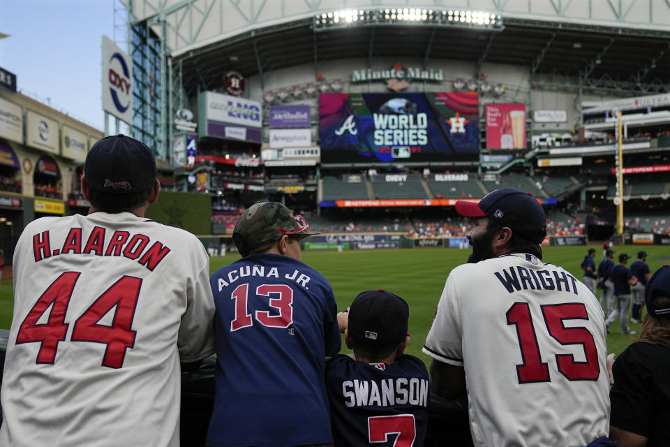Fans watch during batting practice before Game 6 of baseball's World Series between the Houston Astros and the Atlanta Braves Tuesday, Nov. 2, 2021, in Houston. (AP Photo/Ashley Landis)
