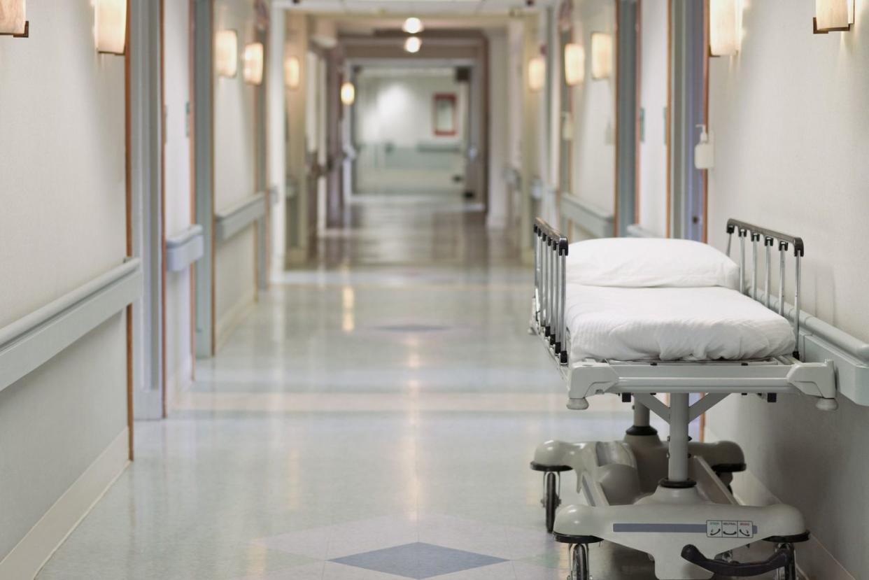 Portable hospital bed in hallway