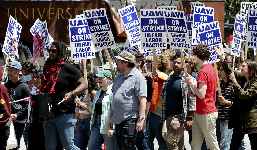University of California, Santa Cruz graduate students and other academic workers in the UAW 4811 union begin a strike and are joined by UCSC students for Justice in Palestine as they picket the main entrance to campus on Monday, May 20, 2024, in Santa Cruz, Calif. (Shmuel Thaler/The Santa Cruz Sentinel via AP)
