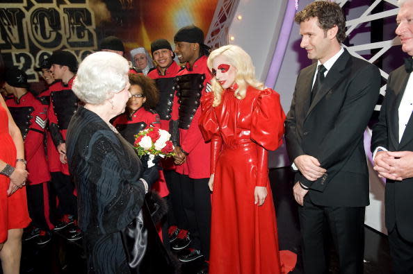 <p>What shall I wear to meet the Queen? Oh yes, that red dress i own made entirely out of latex. We’ll give Gaga one thing, it’s definitely one way to be memorable.<i> [Photo: Anwar Hussein/Getty Images]</i></p>