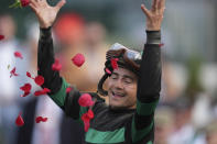 Brian Hernandez Jr. celebrates in the winner's circle after riding Mystik Dan to win the 150th running of the Kentucky Derby horse race at Churchill Downs Saturday, May 4, 2024, in Louisville, Ky. (AP Photo/Abbie Parr)