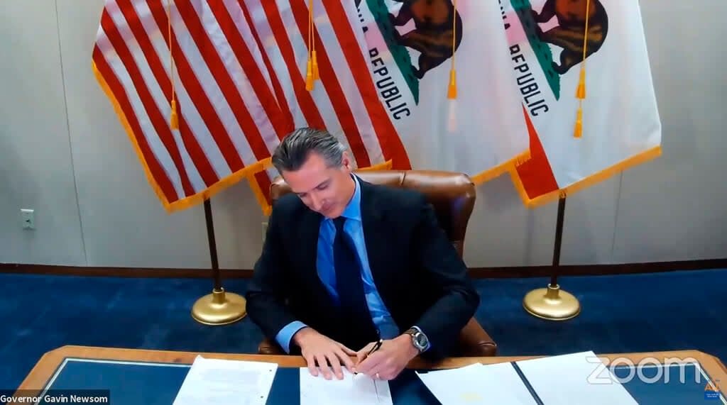In this image made from video from the Office of the Governor California Gov. Gavin Newsom signs into law a bill that establishes a task force to come up with recommendations on how to give reparations to Black Americans on Sept. 30, 2020, in Sacramento, Calif. (Office of the Governor via AP, File)