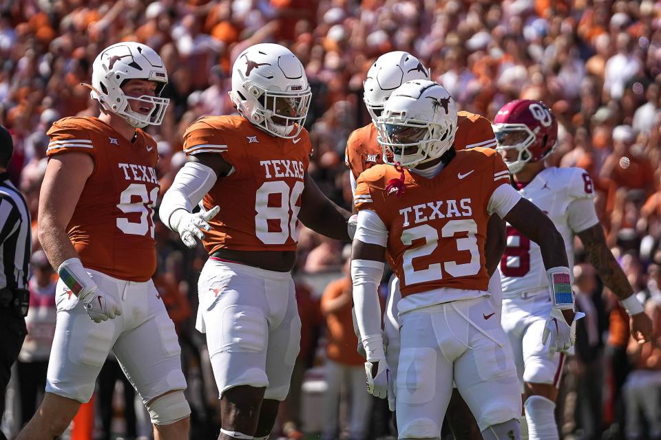 Texas defensive back Jahdae Barron, right, celebrates a special teams play during the Oct. 7 loss to Oklahoma. The No. 8 Longhorns, who were off last week, resume the second half of the season this week at Houston.