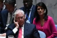 US Secretary of State Rex Tillerson (L) and Ambassador to the UN Nikki Haley (R) listen as China's Foreign Minister Wang Yi (not in picture) speaks during a security council meeting on North Korea at the UN headquarters in New York on April 28, 2017