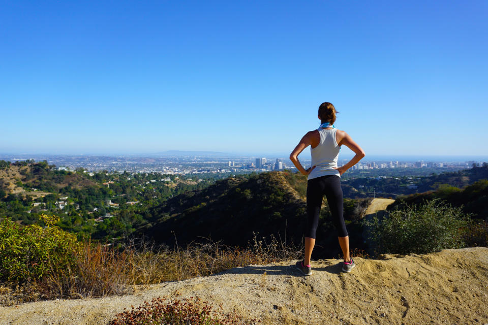 A woman taking in the hiking views of Los Angeles