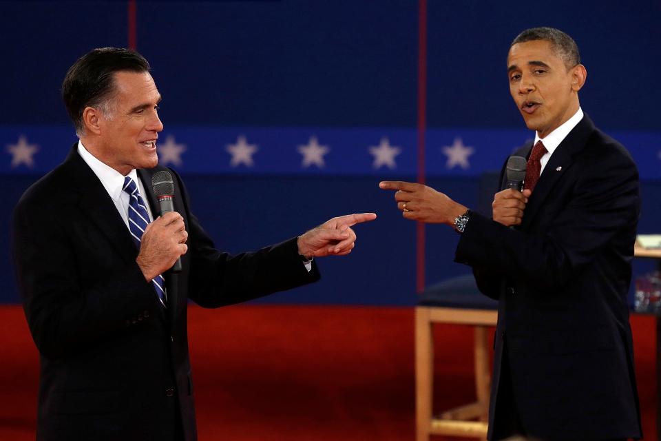 In this Oct. 16, 2012 file photo, Republican presidential nominee Mitt Romney, left, and President Barack Obama spar during a presidential debate at Hofstra University in Hempstead, N.Y.