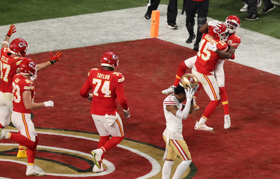 Kansas City Chiefs' Mecole Hardman Jr., Patrick Mahomes and teammates celebrate after winning Super Bowl LVIII.<span class="copyright">Mike Blake—Reuters</span>