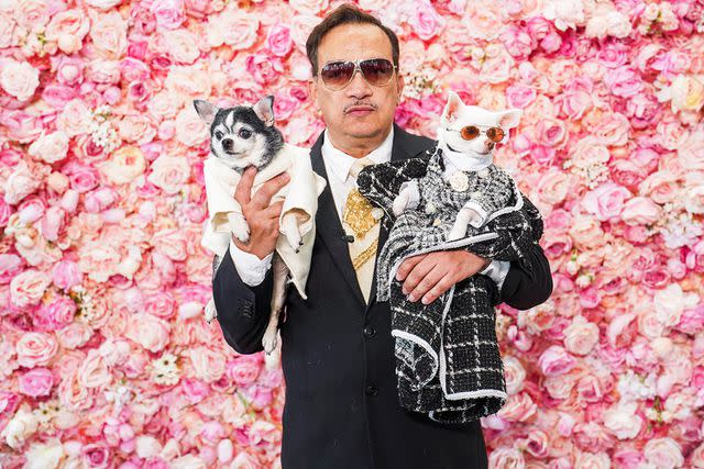 <p>Hideki Aono</p> Fashion designer Anthony Rubio with two dogs wearing outfits he created