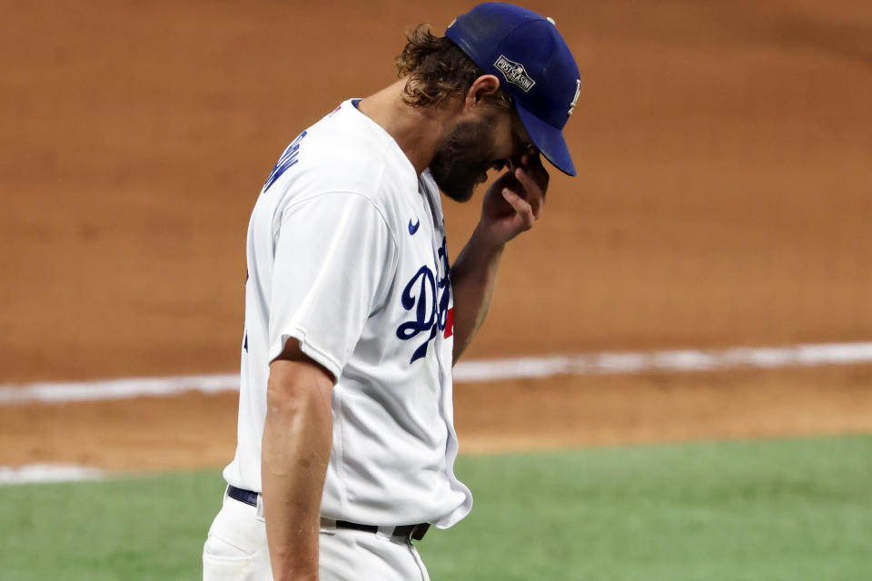 ARLINGTON, TEXAS - OCTOBER 07: Clayton Kershaw #22 of the Los Angeles Dodgers reacts as he walks to the dugout during the sixth inning against the San Diego Padres in Game Two of the National League Division Series at Globe Life Field on October 07, 2020 in Arlington, Texas. (Photo by Tom Pennington/Getty Images)