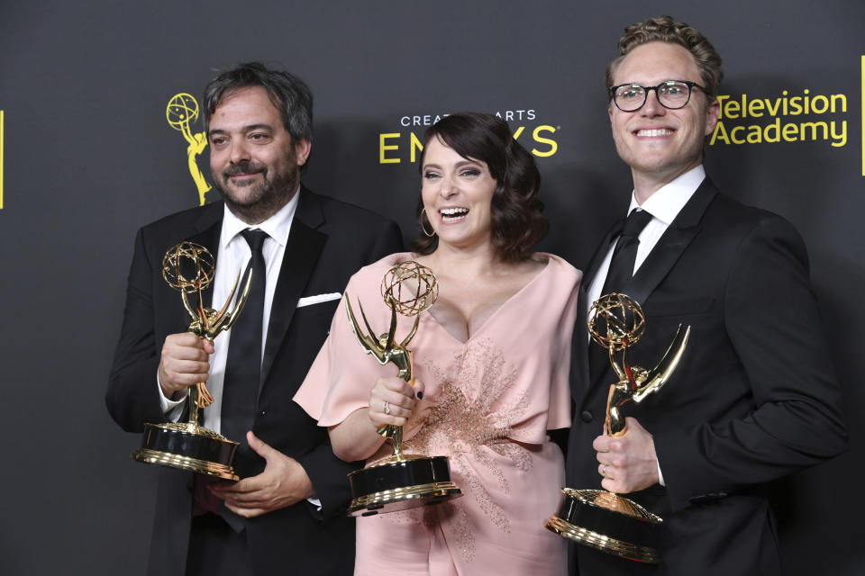 Adam Schlesinger, from left, Rachel Bloom and Jack Dolgen pose in the press room with their awards for outstanding original music and lyrics for "Crazy Ex Girlfriend" on night one of the Creative Arts Emmy Awards on Saturday, Sept. 14, 2019, at the Microsoft Theater in Los Angeles. (Photo by Richard Shotwell/Invision/AP)