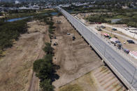 An area where migrants, many from Haiti, were encamped is seen after crews cleared the zone along the Del Rio International Bridge, Friday, Sept. 24, 2021, in Del Rio, Texas. (AP Photo/Julio Cortez)