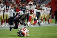 San Francisco 49ers running back Matt Breida (22) avoids the tackles of Arizona Cardinals cornerback Patrick Peterson (21) during the first half of an NFL football game, Thursday, Oct. 31, 2019, in Glendale, Ariz. (AP Photo/Rick Scuteri)