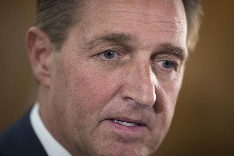 Sen. Jeff Flake, R-Ariz., speaks with reporters in Washington on Dec. 6. (Photo: J. Scott Applewhite/AP)