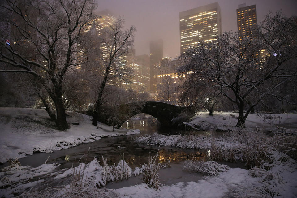 <p>The Gapstow Bridge in Central Park is seen with midtown Manhattan in the background as a winter storm passes through the area, dumping 7 to 11 inches of the white stuff on March 7, 2018. (Photo: Gordon Donovan/Yahoo News) </p>