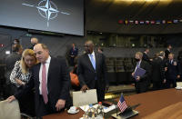 United States Defense Secretary Lloyd J. Austin III, center, waits for the start of a meeting of NATO defense ministers at NATO headquarters in Brussels, Thursday, Oct. 21, 2021. NATO defense ministers gather for their fall meeting to assess the fallout of Moscow's closure of its mission to the alliance and an overall worsening of relations with Moscow. (AP Photo/Virginia Mayo)