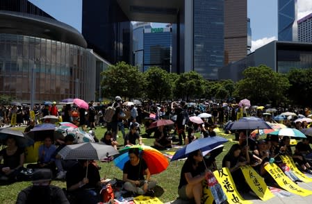 Demonstrators attend a rally to call for democratic reforms at Tamar Park in Hong Kong