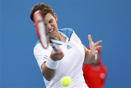 Dominic Thiem of Austria hits a return to Kevin Anderson of South Africa during their men's singles match at the Australian Open 2014 tennis tournament in Melbourne January 15, 2014. REUTERS/Brandon Malone