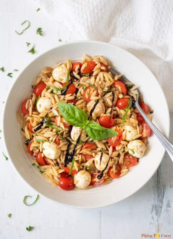 <p>Piping Pot Curry</p><p>A light and refreshing side dish, made with orzo pasta, grape tomatoes, mozzarella and fresh basil. </p><p><strong>Get the recipe: </strong><a href="https://pipingpotcurry.com/caprese-orzo-pasta-salad/?fbclid=IwAR22Sl6bz3KOChT1TE_oWMY88vJvAFREWNOx3ssTAyms3zEuWJNuPC2WL0s" rel="nofollow noopener" target="_blank" data-ylk="slk:Caprese Orzo Pasta Salad;elm:context_link;itc:0;sec:content-canvas" class="link rapid-noclick-resp"><strong>Caprese Orzo Pasta Salad</strong></a></p>