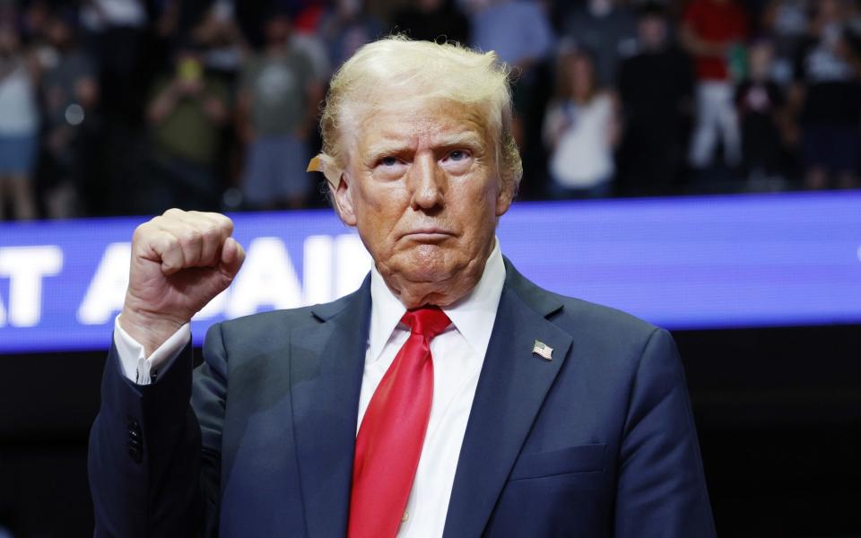 Donald Trump speaks during a campaign rally at the Van Andel Arena in Grand Rapids