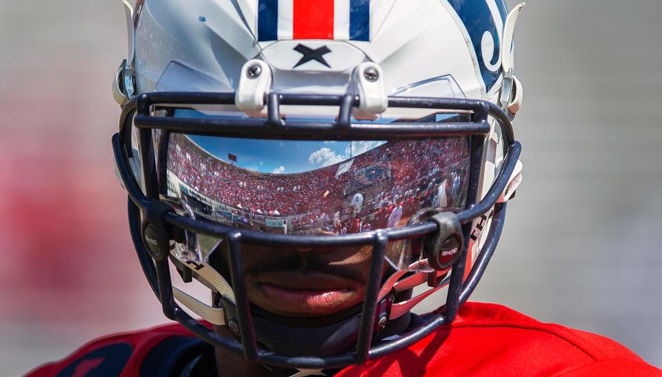 The Jackson State crowd at Mississippi Veterans Memorial Stadium is reflected in the face shield of JSU quarterback Shedeur Sanders during a pause in the game against Grambling in an NCAA college football game against in Jackson, Miss., Saturday, Sept. 17, 2022. Sanders made six touchdowns during the game, two rushing and four passing. JSU won 66-24.