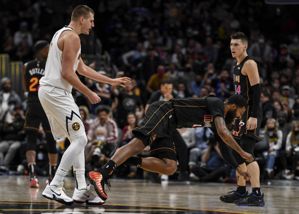 DENVER, CO - NOVEMBER 8: Nikola Jokic (15) of the Denver Nuggets hits Markieff Morris (8) of the Miami Heat with a retaliatory blow after Morris bumped Jokic near mid court during the fourth quarter of Denver