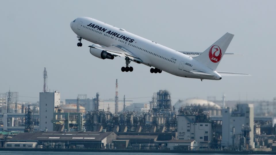 A Japan Airlines  passenger jet takes off from Haneda Airport in Tokyo. The Japanese government gives its citizens explicit instructions on what to do if caught in an active shooter incident in the United States. - Kazuhiro Nogi/AFP/Getty Images