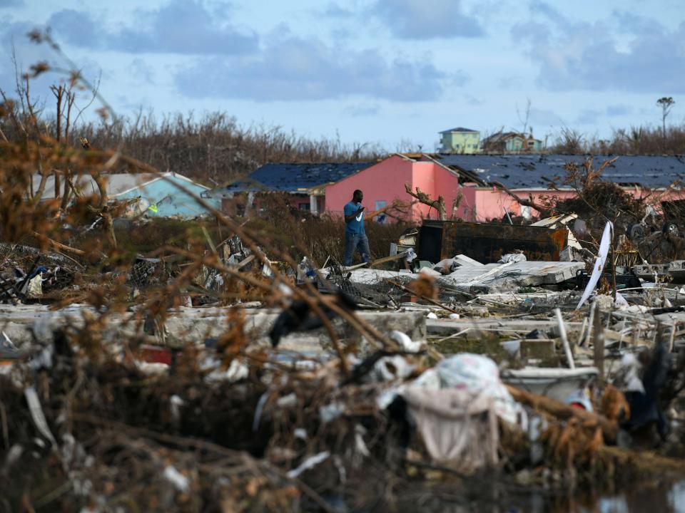 A man searches for belongings amongst debris in a destroyed neighborhood in the wake of Hurricane Dorian in Marsh Harbour, Great Abaco, Bahamas, September 8, 2019.  REUTERS/Loren Elliott