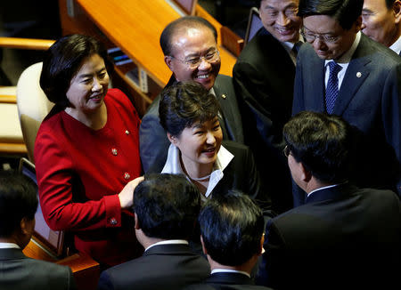 South Korean President Park Geun-hye leaves after delivering her speech on the 2017 budget bill during a plenary session at the National Assembly in Seoul, South Korea, October 24, 2016. REUTERS/Kim Hong-Ji