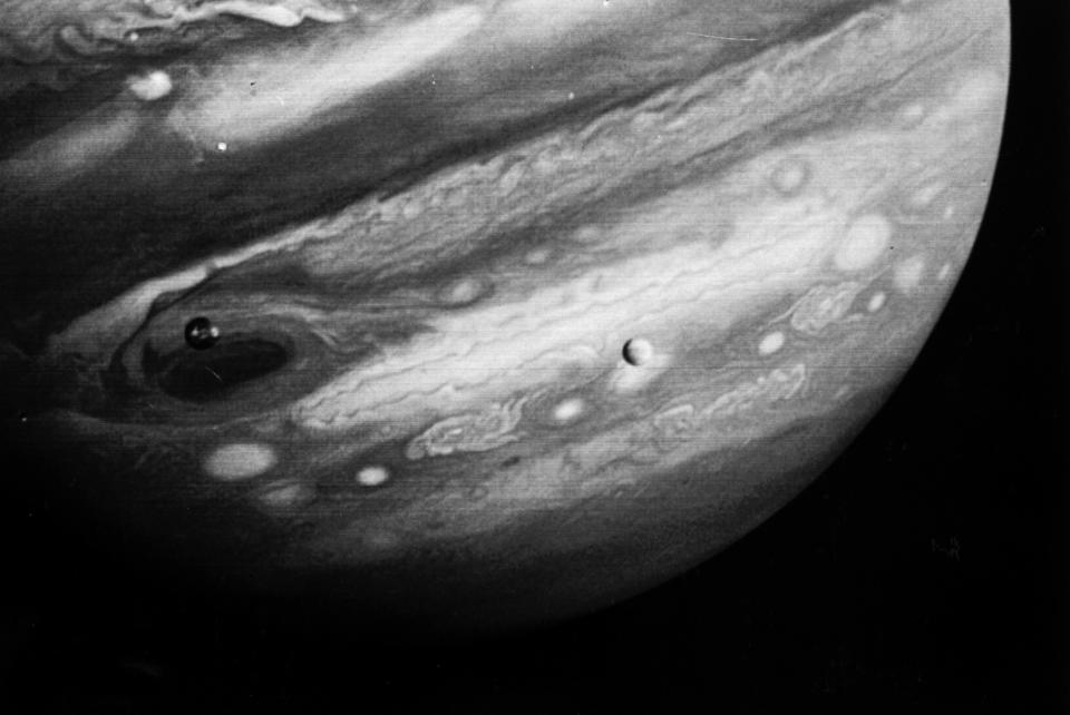 FILE - This Feb. 13, 1979 photo released by NASA's Jet Propulsion Laboratory on Feb. 22, 1979 shows the planet Jupiter and two of its moons, Io, left, and Europa, center. The Voyager 1 spacecraft was about 12.4 million miles from Jupiter when the photo was made. NASA said Tuesday, March 4, 2014 it is making preparations to plan a robotic mission to Jupiter's watery moon Europa, a place where astronomers speculate there might be life. The space agency set aside $15 million in its 2015 budget proposal to start planning a mission to Europa. No details were released but NASA chief financial officer Elizabeth Robinson said Tuesday that it would be launched in the mid-2020s. (AP Photo/NASA, Jet Propulsion Laboratory)