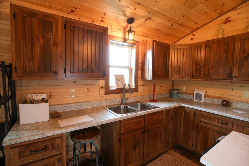 Inside the kitchen and dining area of an Amish Made Cabin.   The manufacturer in Shepherdsville is a family-owned-and-operated business that has been building modular cabins for nearly 16 years.  Each cabin is constructed at their manufacturing shop in Munfordville, then delivered to their destinations.