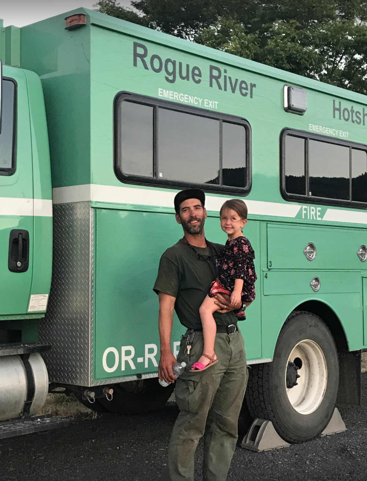 Luke Mayfield with his daughter during his time on a Hotshot crew in Rogue River, Oregon (Courtesy of Luke Mayfield)