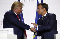 French President Emmanuel Macron, right, and U.S President Donald Trump shake hands during the final press conference during the G7 summit Monday, Aug. 26, 2019 in Biarritz, southwestern France. French president says he hopes for meeting between US President Trump and Iranian President Rouhani in coming weeks. (AP Photo/Francois Mori)