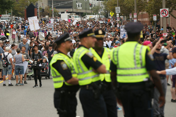 <p>Police stand by as thousands of protesters prepare to march in Boston against a planned ‘Free Speech Rally’ just one week after the violent ‘Unite the Right’ rally in Virginia left one woman dead and dozens more injured on August 19, 2017 in Boston, Mass. (Photo: Spencer Platt/Getty Images) </p>