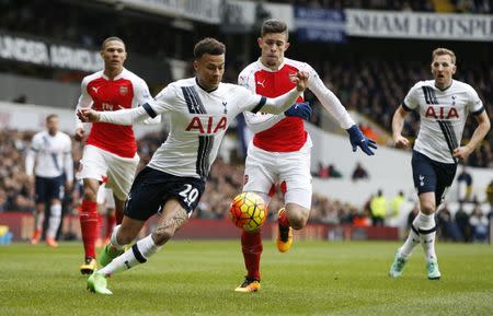 Football Soccer - Tottenham Hotspur v Arsenal - Barclays Premier League - White Hart Lane - 5/3/16 Tottenham's Dele Alli in action with Arsenal's Gabriel Paulista Action Images via Reuters / Paul Childs Livepic EDITORIAL USE ONLY. No use with unauthorized audio, video, data, fixture lists, club/league logos or "live" services. Online in-match use limited to 45 images, no video emulation. No use in betting, games or single club/league/player publications. Please contact your account representative for further details. - RTS9F0B