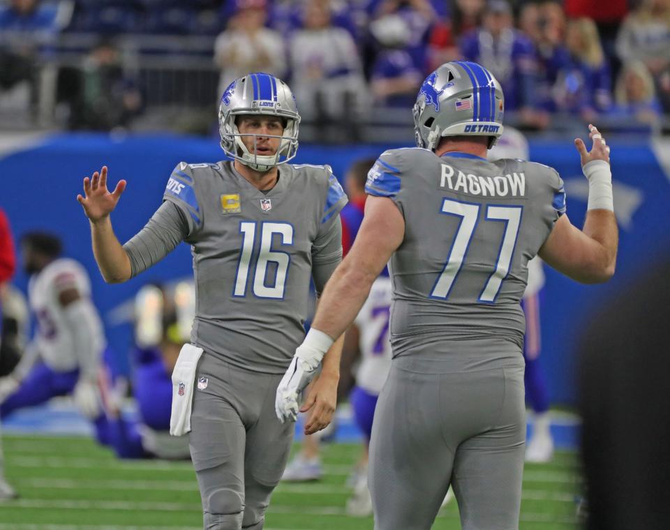 Lions quarterback Jared Goff and center Frank Ragnow warm up before the game against Bills on Thursday, Nov. 24, 2022, at Ford Field.