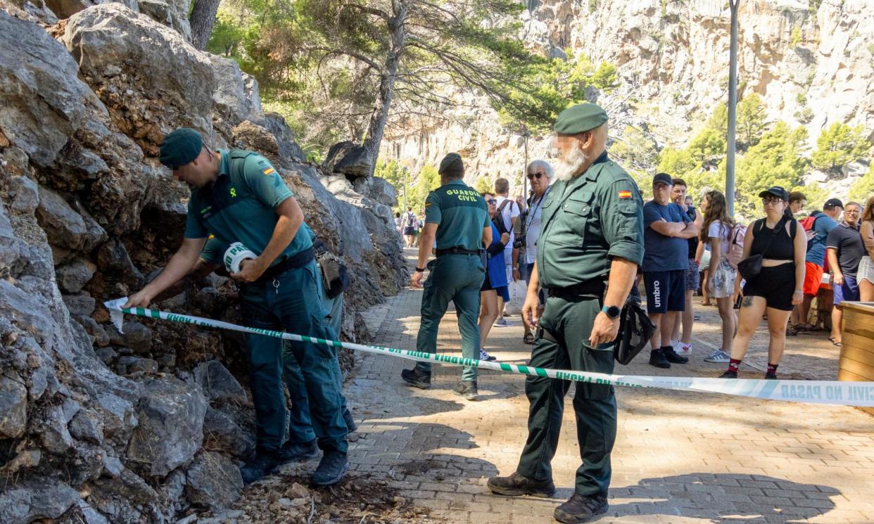 <span>Spanish emergency services search for the missing tourist near Torrent de Pareis, Sa Calobra, after strong winds and heavy rain hit the island.</span><span>Photograph: Cati Cladera/EPA</span>