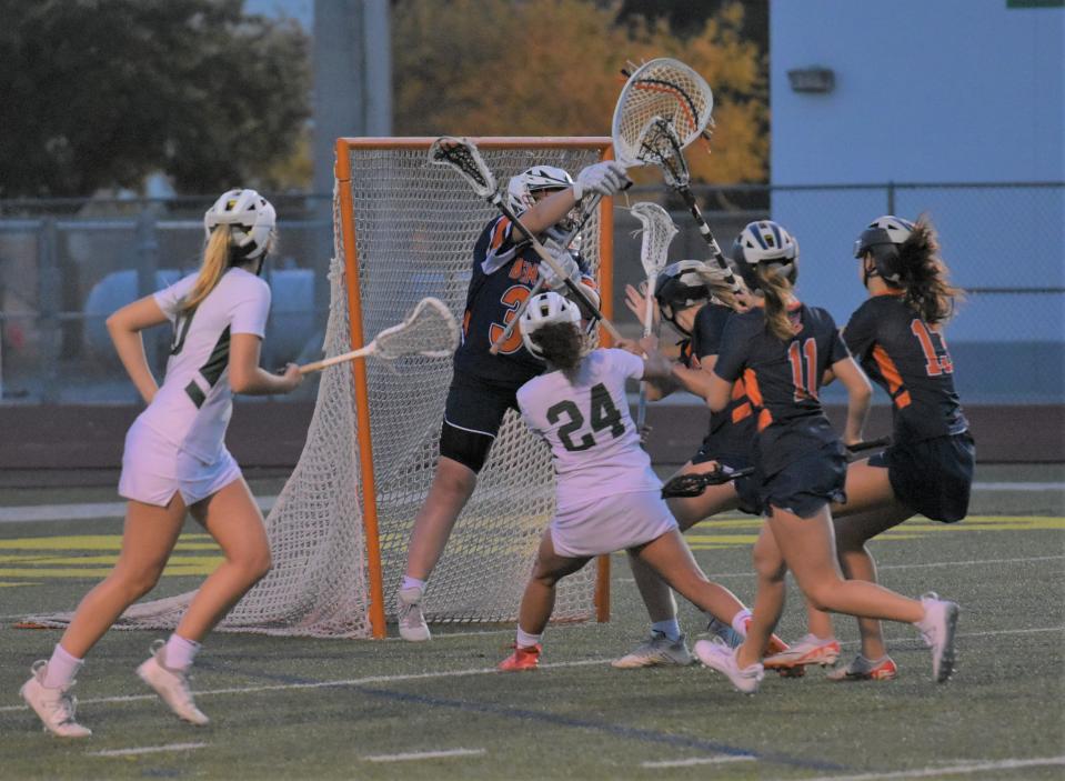 Benjamin's Rachel Haueisen raises her stick to make a close-range save during a regular season victory over Jupiter on Mar. 14, 2024.