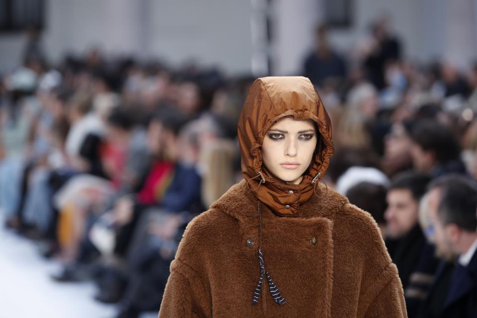 A model wears a creation as part of Max Mara's Fall/Winter 2020/2021 collection, presented in Milan, Italy, Thursday, Feb. 20, 2020. (AP Photo/Antonio Calanni)