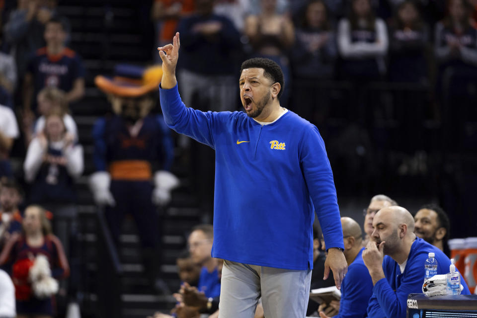 Pittsburgh coach Jeff Capel yells to players during the first half of the team's NCAA college basketball game against Virginia on Tuesday, Feb. 13, 2024, in Charlottesville, Va. (AP Photo/Mike Kropf)