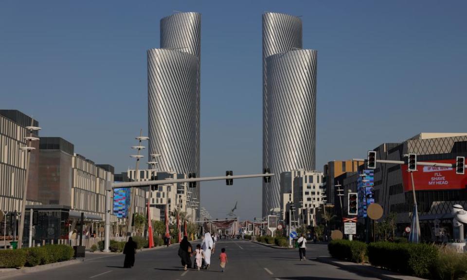 A family walk down the car-free as the four towers at Al Sa’ad Plaza can be seen from Lusail Boulevard.