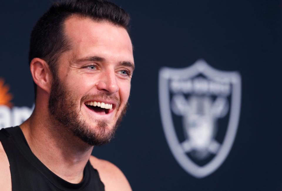 Las Vegas Raiders quarterback Derek Carr talks with reporters during NFL football training camp Saturday, July 30, 2022, in Henderson, Nev. (AP Photo/Steve Marcus)