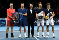 Tennis - ATP Finals - The O2, London, Britain - November 18, 2018 Mike Bryan and Jack Sock of the U.S. pose for a photo after winning the doubles final alongside runners up France's Pierre-Hugues Herbert and Nicolas Mahut Action Images via Reuters/Tony O'Brien