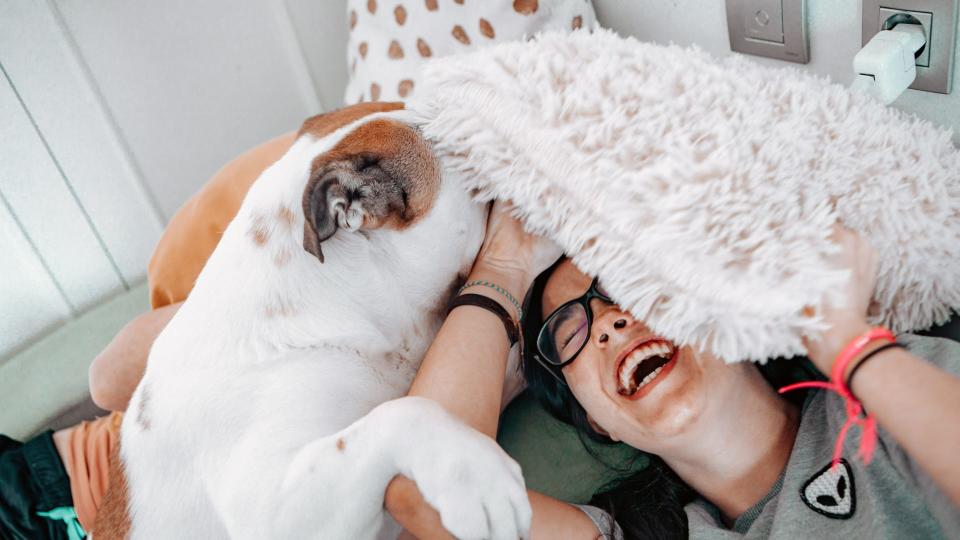 Woman playing with dog