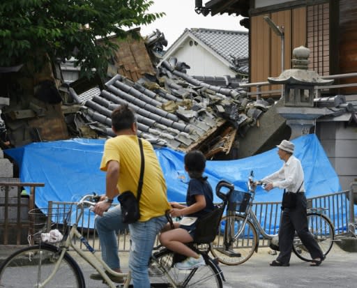 Japanese officials are working to quickly restore gas and running water to homes cut off after a powerful quake struck Osaka on Monday