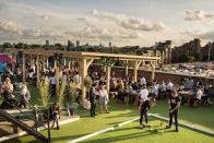 <p>The east London rooftop venue in Tobacco Dock will be screening matches against the scenic London skyline.</p><p>As well as lawn games like croquet, during the World Cup months punters can take part in a penalty shoot-out at half time. It's free to get in, but you can also book tables.</p>