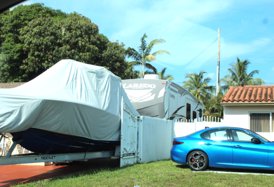 Photograph of violations of the City of Hialeah code regarding the use of recreational vehicles, including motor homes and boats. The city seeks to limit them, to avoid renting as alternative housing